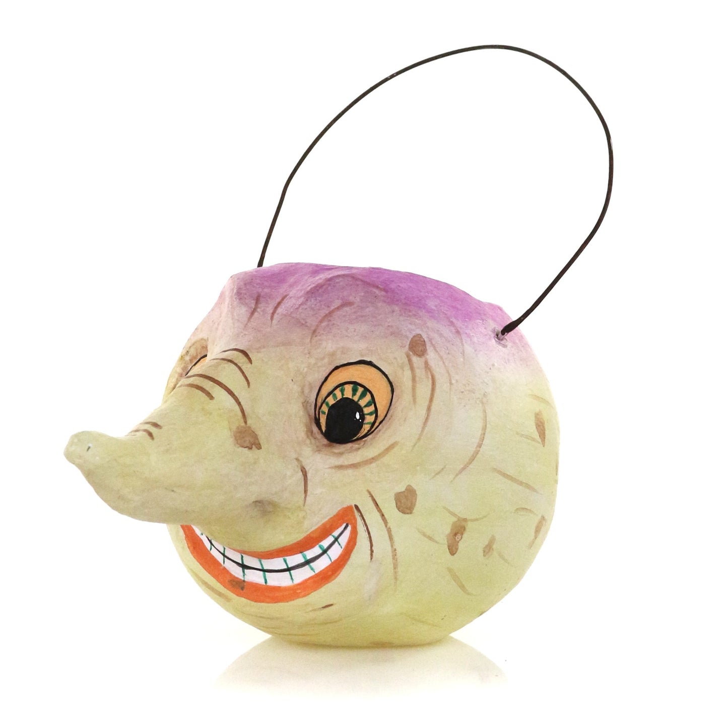 Handcrafted papier-mâché turnip Halloween candy bucket with a distressed finish, painted face, and wire handle.
