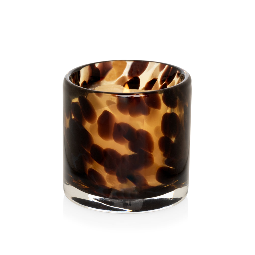 Tortoise pattern glass votive candle holder, 2.75"Dia x 2.75"H, with a lit tealight inside.