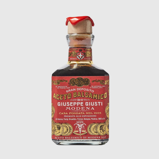Hudson Grace Giuseppe Giusti 3 Gold Medals balsamic vinegar in a glass bottle with a red wax-sealed cork stopper.
