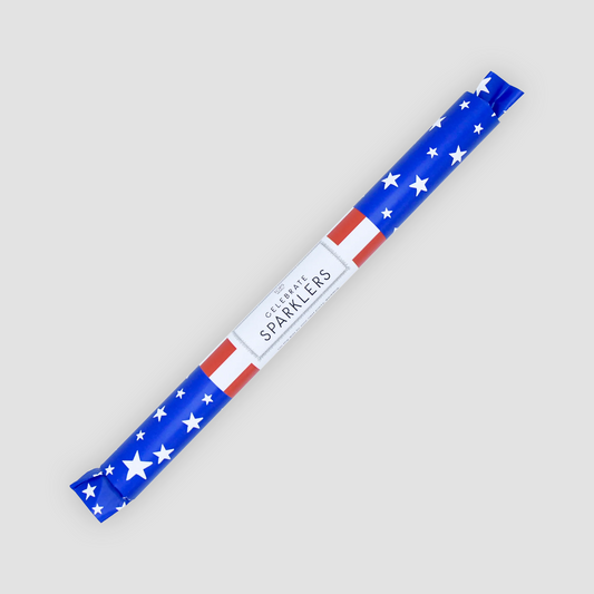 4th of July Deluxe Sparklers tube, blue with white stars, red and white stripes, and "Celebrate Sparklers" label.