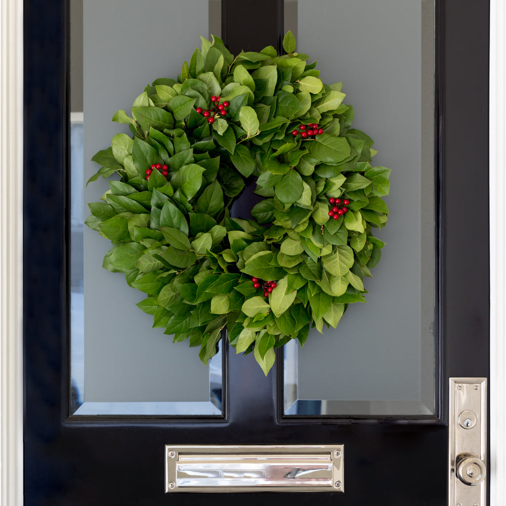 wreath holiday decoration green salal and red berries 