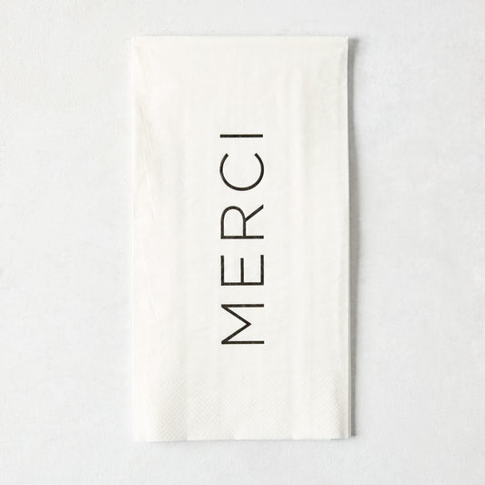White 3-ply paper hand towel with the word MERCI printed in black, 5.5-inch square disposable napkin.