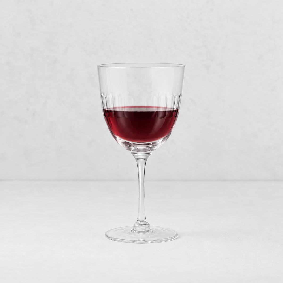 Harrington hand-blown lead-free crystal red wine glass with hand-cut oval detailing and a thin stem.
