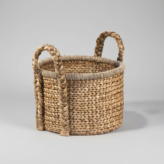 Woven basket with handles on a white background