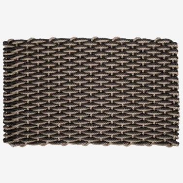 Woven rectangular doormat with a textured pattern on a white background