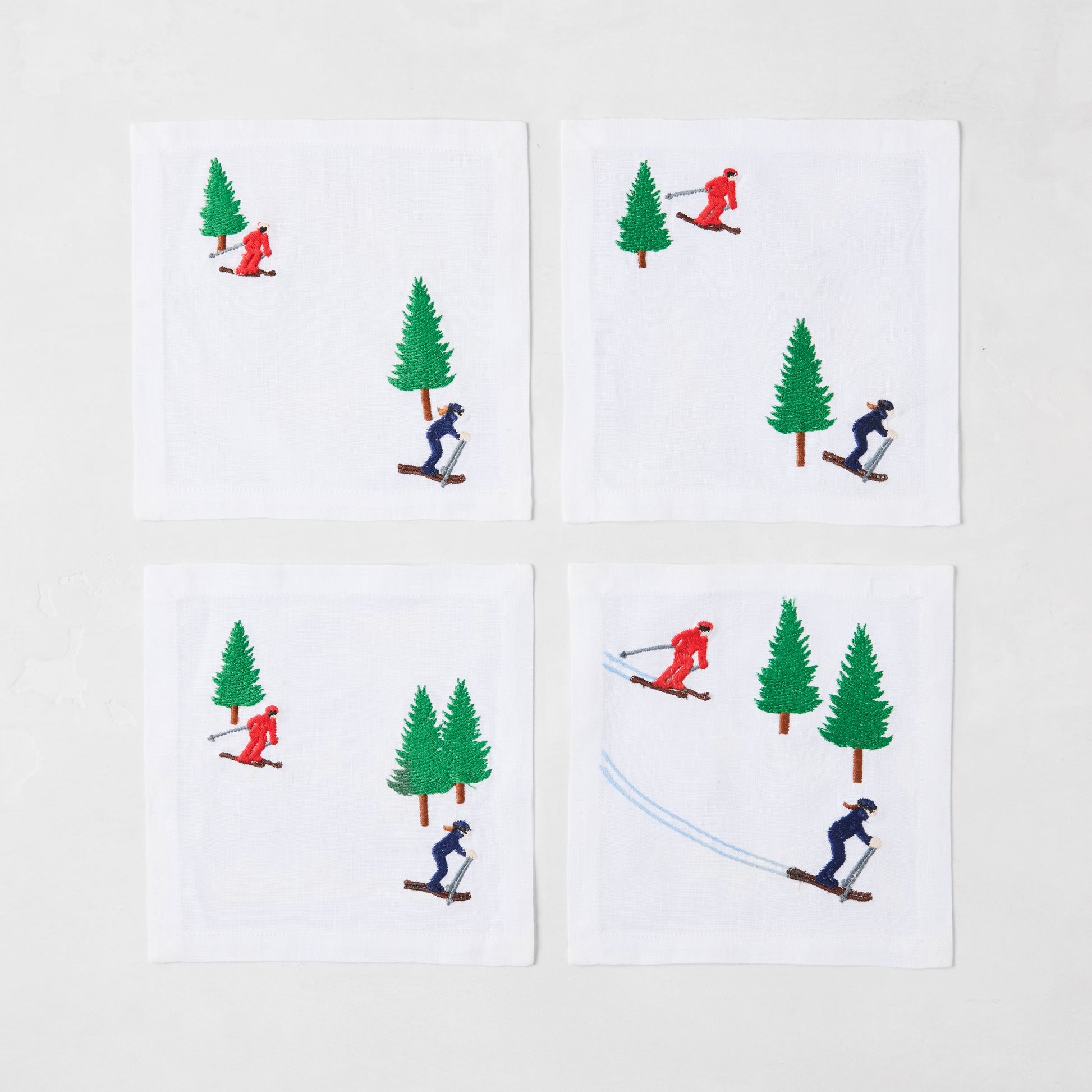 Four skier embroidered coasters 
