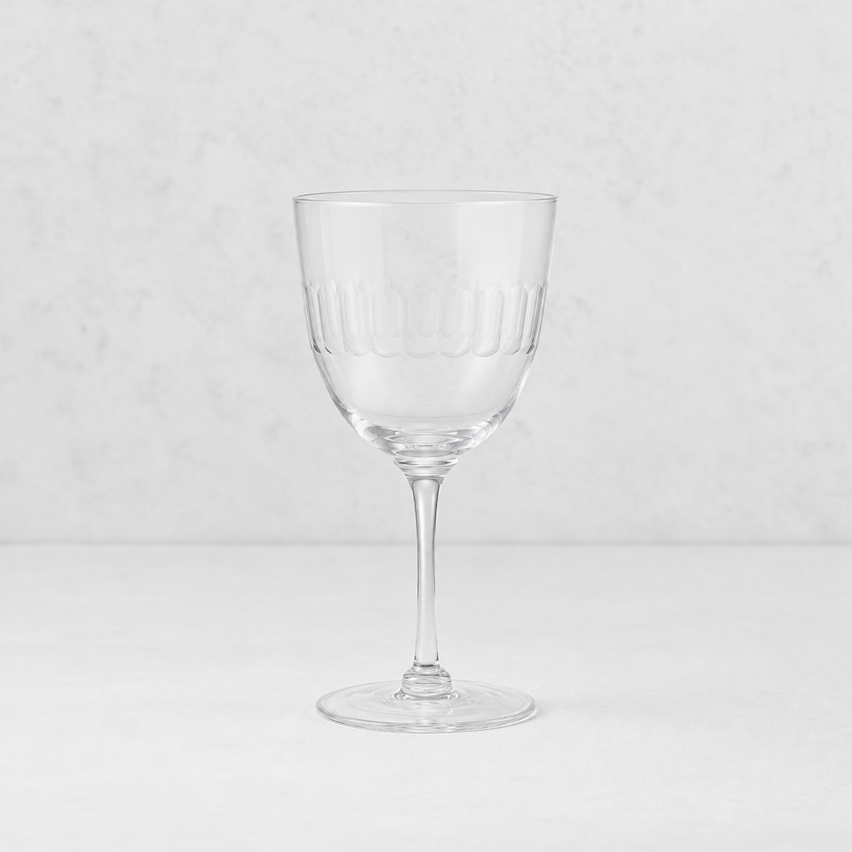 Harrington lead-free crystal red wine glass with a hand-cut oval pattern on a thin, elegant stem.