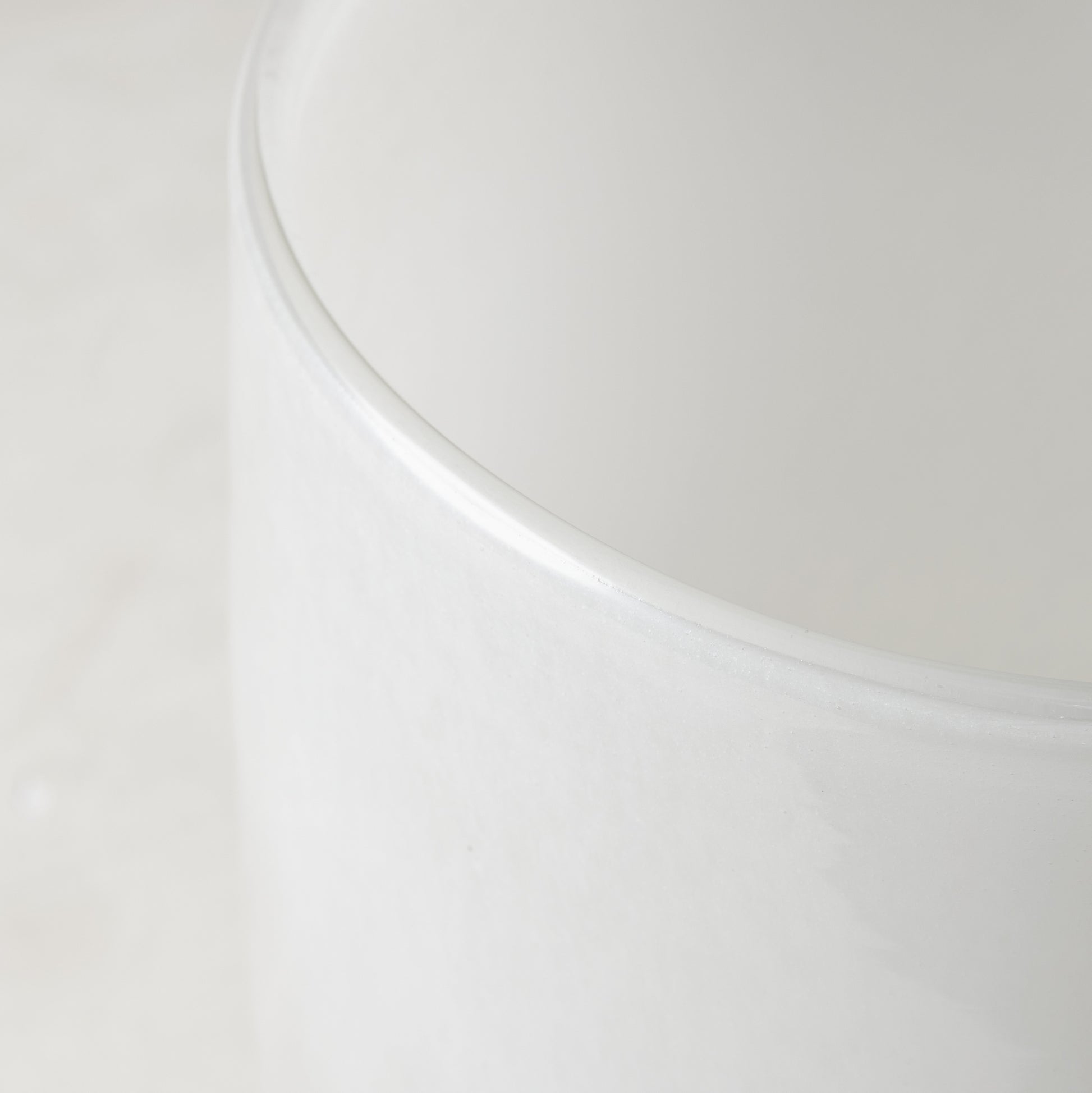 white round vase with curves