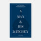 A Man & His Kitchen" hardcover cookbook with dark blue cover, white text, and subtle cast iron pan graphic.