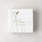 White 3-ply paper cocktail napkins with a martini glass and "a tini bit older" in olive green.