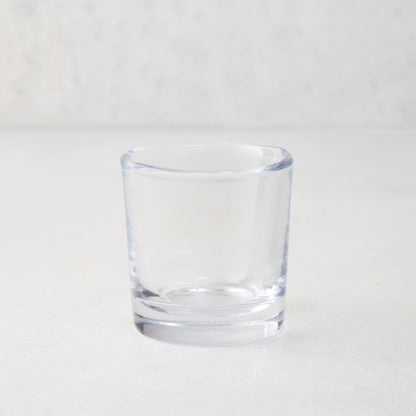 Clear Abraham Scissor-Cut 6 oz. glass tumbler with a rippled rim, on a light background.