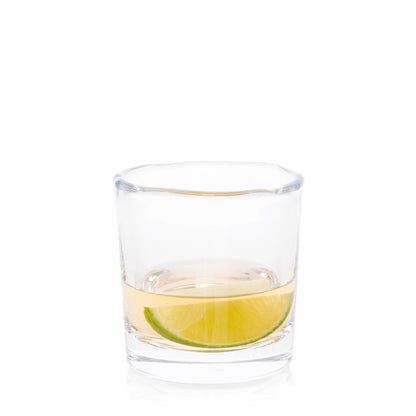 Abraham Scissor-Cut Glass Tumbler, 6 oz, with a lime slice and clear liquid, on a white background.