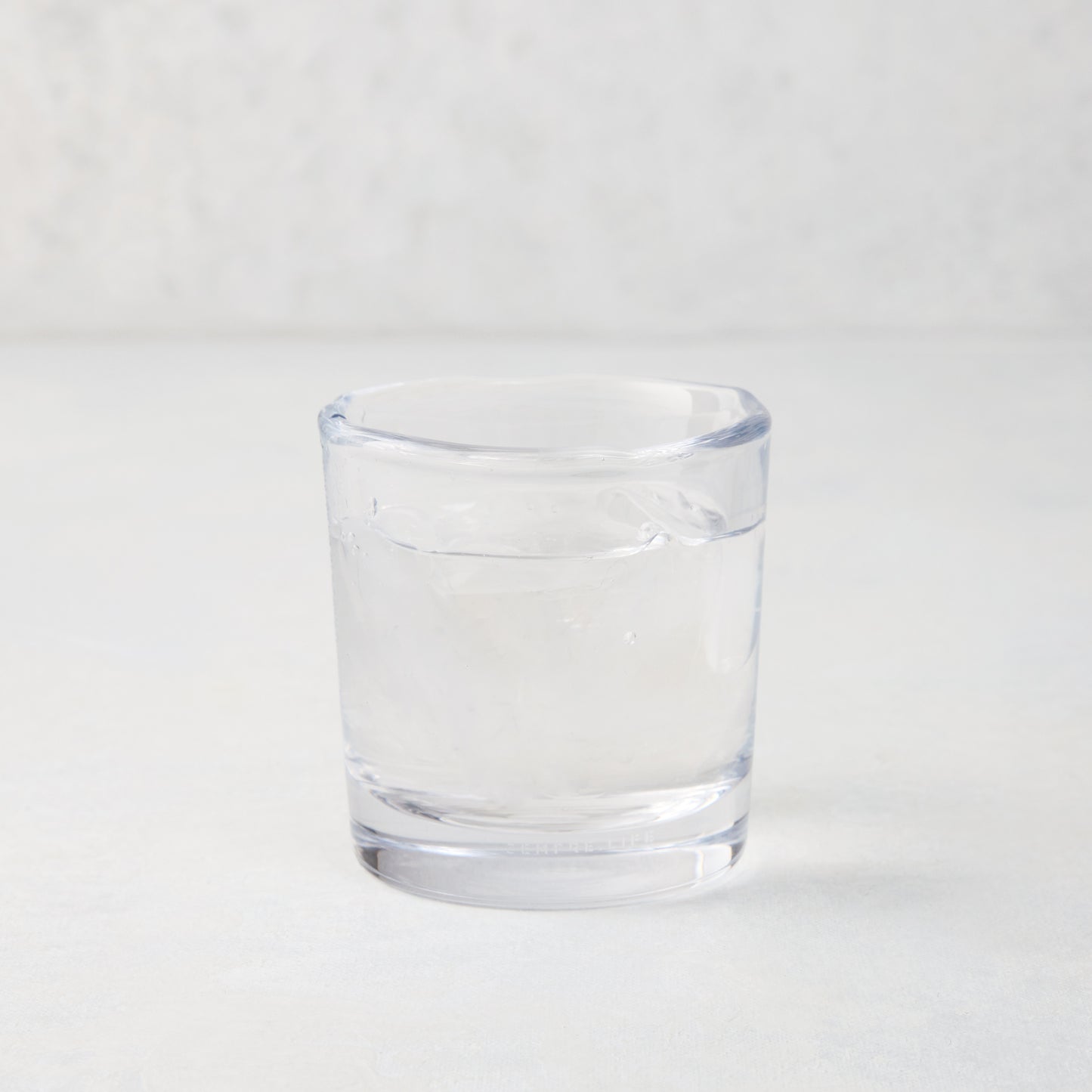Abraham Scissor-Cut Glass Tumbler, 6 oz., clear, thick air-blown glass with rippled rim.