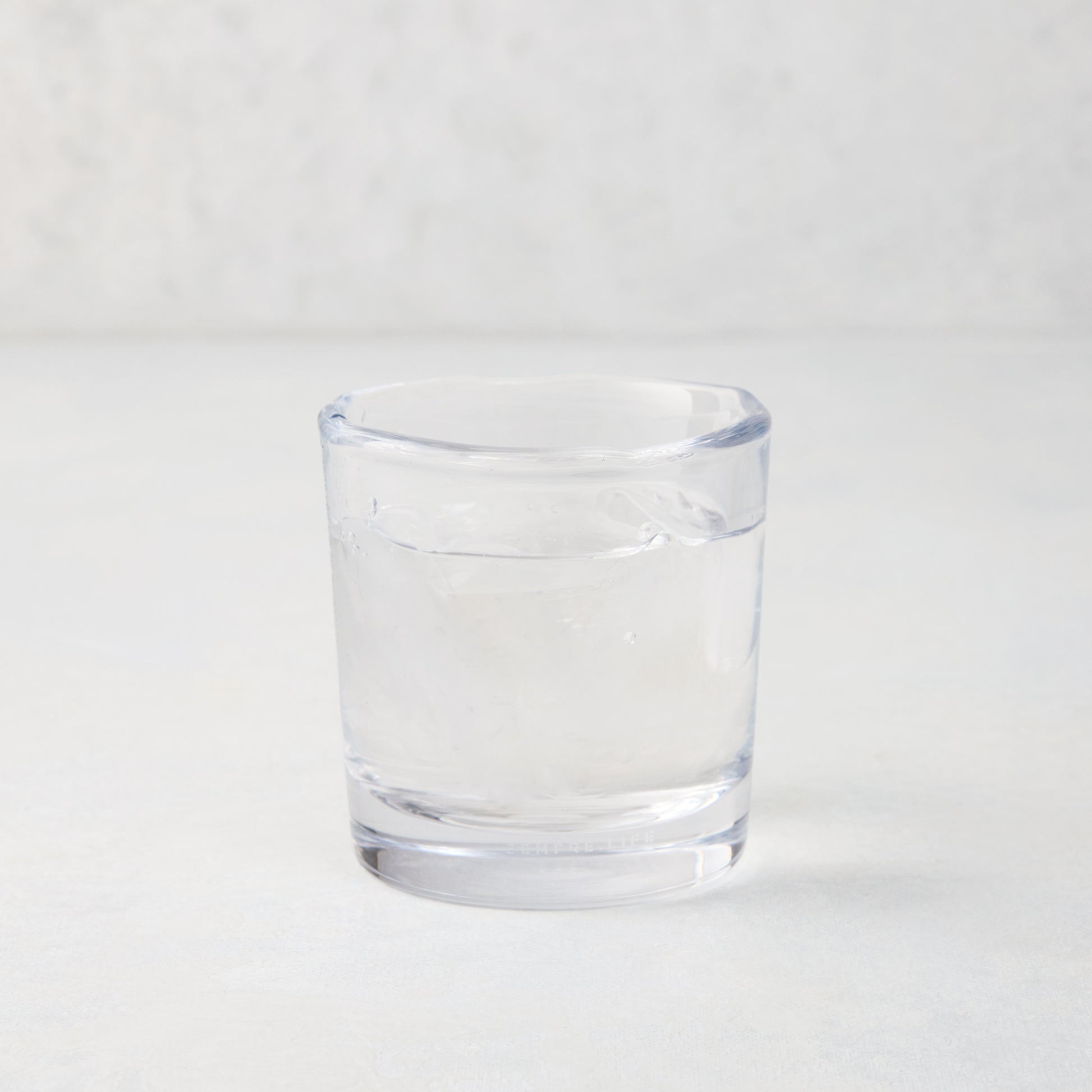 Abraham Scissor-Cut Glass Tumbler, 6 oz., clear, thick air-blown glass with rippled rim.