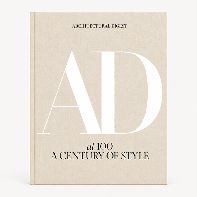 AD at 100: A Century of Style hardcover book with a beige linen cover and large white AD lettering.