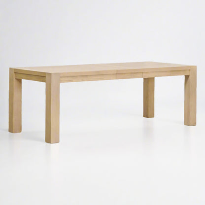 Adler Extension Dining Table in light honey oak with wood veneer top and two extension leaves.