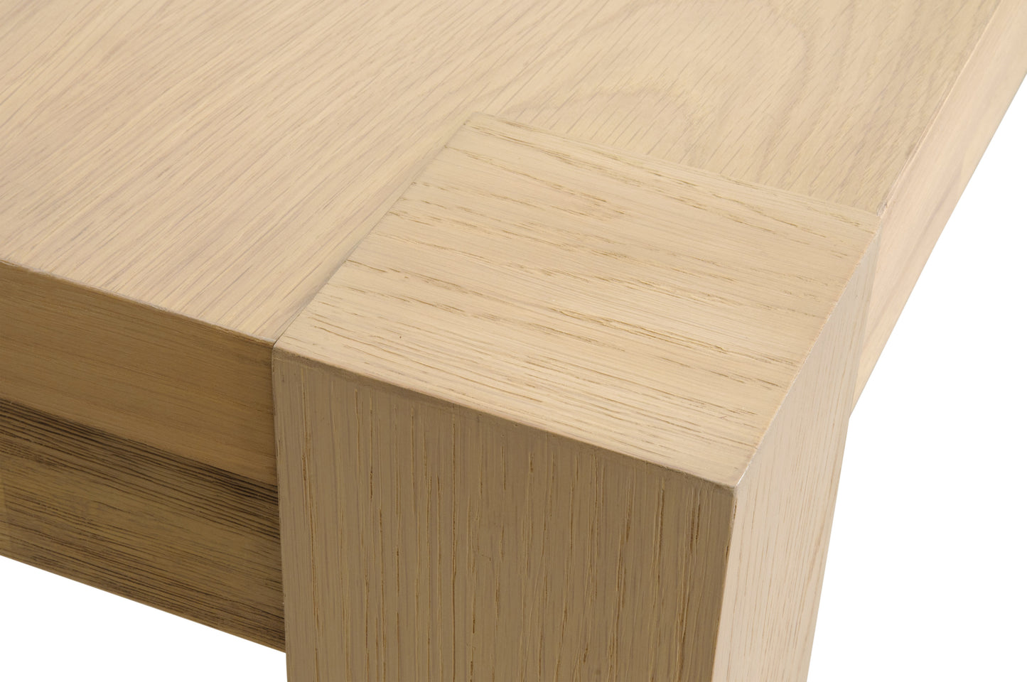 Adler Extension Dining Table corner, light honey oak wood veneer, showing tabletop and leg detail.