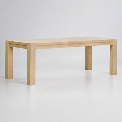 Adler Extension Dining Table in light honey oak with wood veneer top, showing two removable leaves.