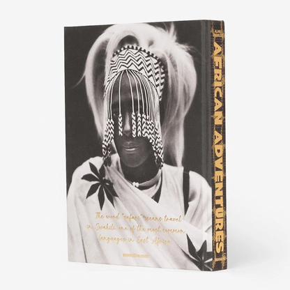 African Adventures book, silk hardcover, black and white photo of a person in traditional African attire.