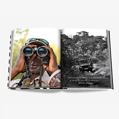 Open "African Adventures" silk hardcover book displaying a man with binoculars and a safari jeep.