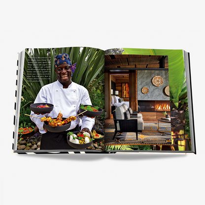 Open "African Adventures" book showing a smiling chef with food and a luxurious lodge interior.