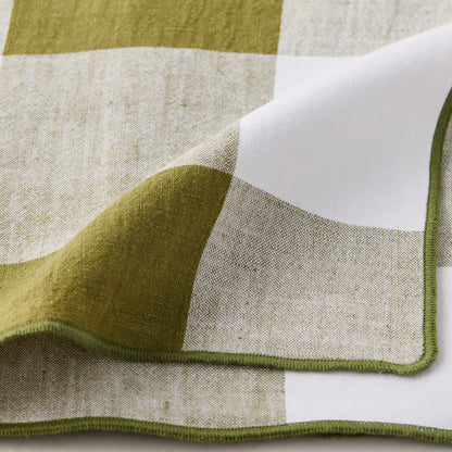 Aloe Green Buffalo Check Linen Napkin, 20" x 20", folded with green stitched edge.