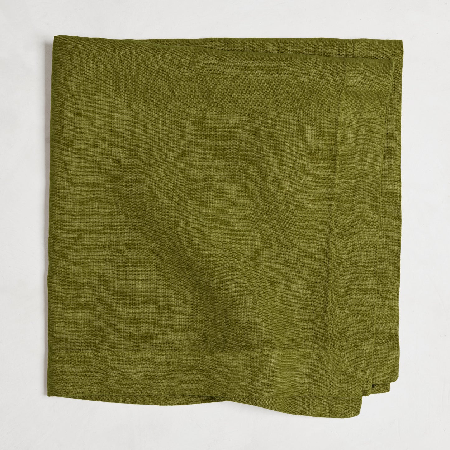 Aloe Green HG Signature Hand-dyed Linen Napkin, 22-inch square, folded.