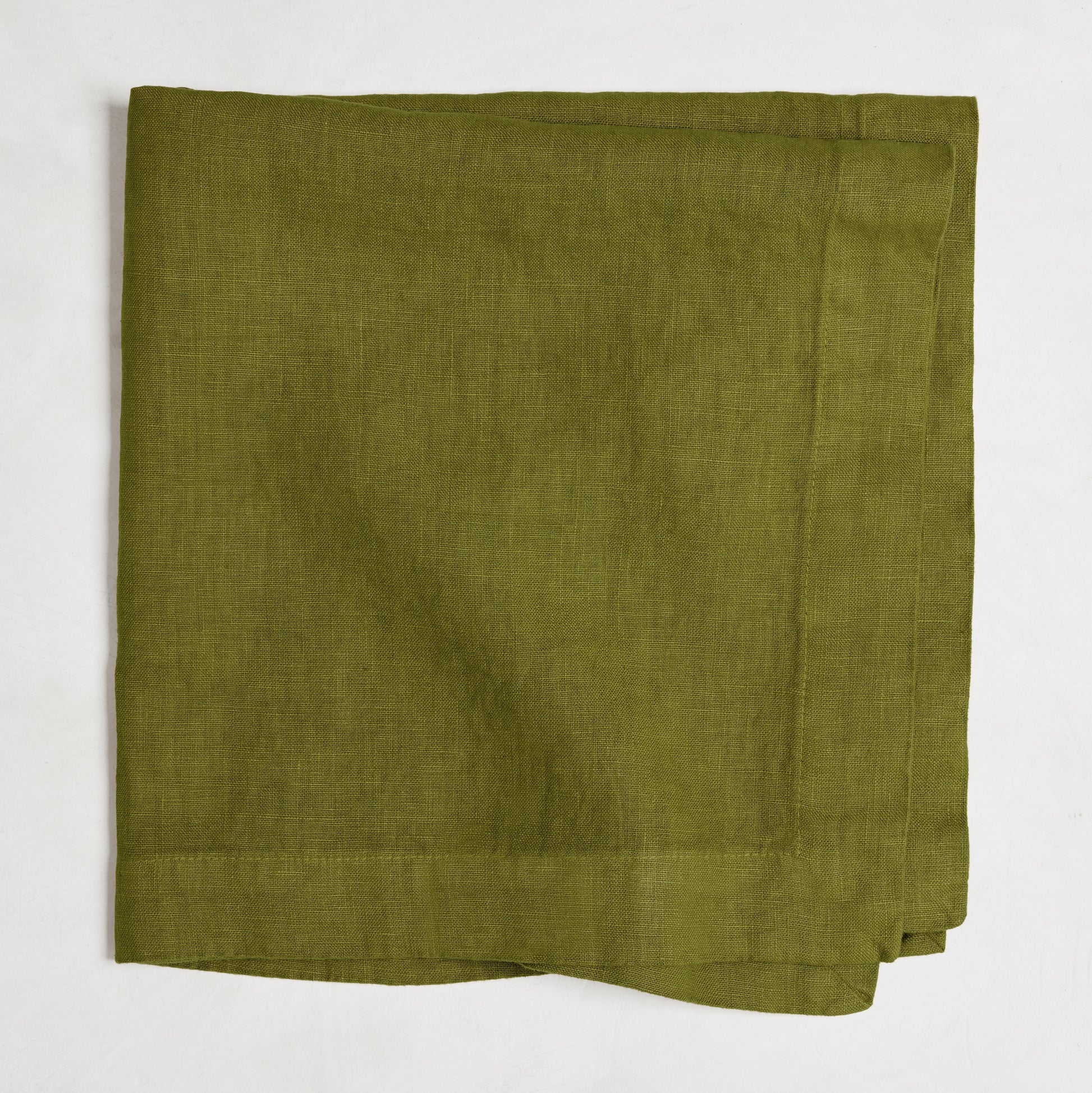 Aloe Green HG Signature Hand-dyed Linen Napkin, 22-inch square, folded.