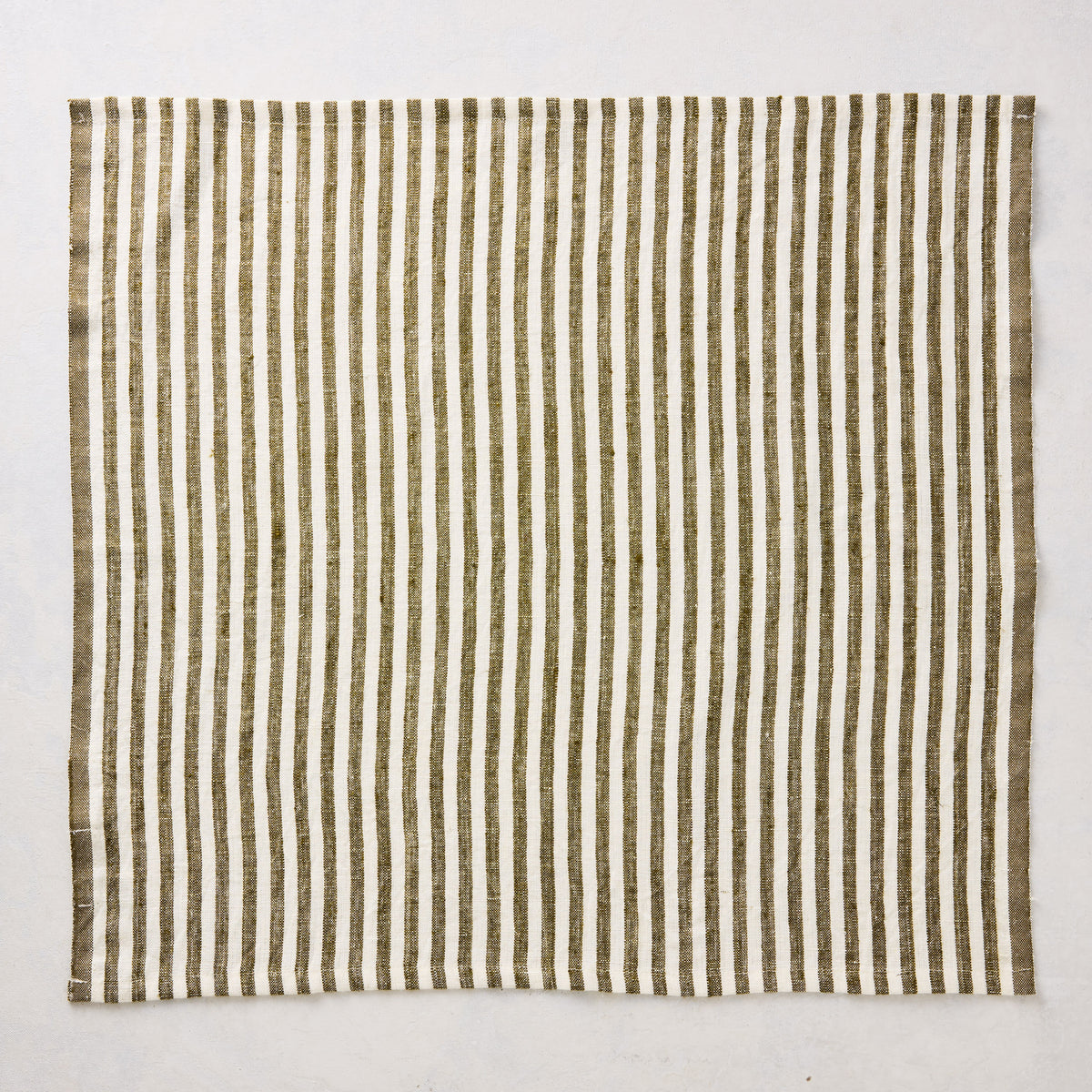 21-inch square linen napkin with green and white ticking stripes on a white background.