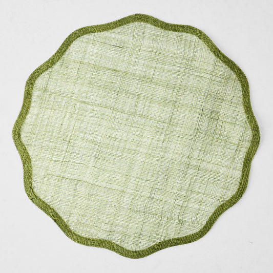 16-inch round aloe green abaca placemat with a semi-transparent woven texture and a solid scalloped border.