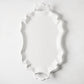 Amalfi white ceramic serving platter with scalloped edges and integrated handles.