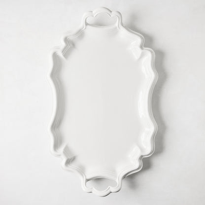 Amalfi white ceramic serving platter with scalloped edges and integrated handles.