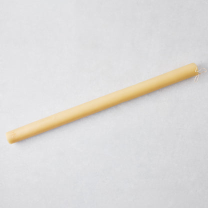 Oversized 22-inch amber taper candle made of paraffin and tree resin with a gold HG logo on a light gray background.