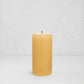 HG Amber Unscented 3"x6" paraffin pillar candle with gold embossed HG logo and cotton wick.
