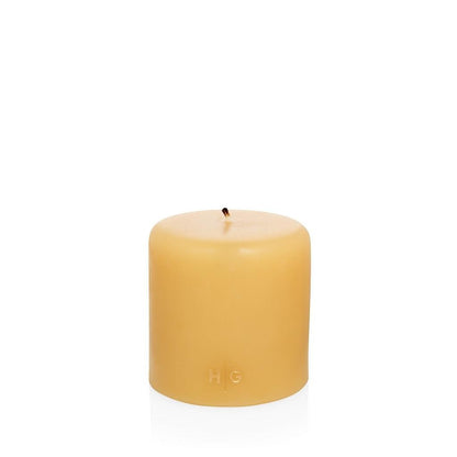HG Amber Unscented Pillar Candle, 4"x4", with a subtle gold HG logo.