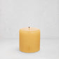 HG Amber Unscented Pillar Candle, 4"x4" paraffin with gold embossed HG logo and cotton wick.
