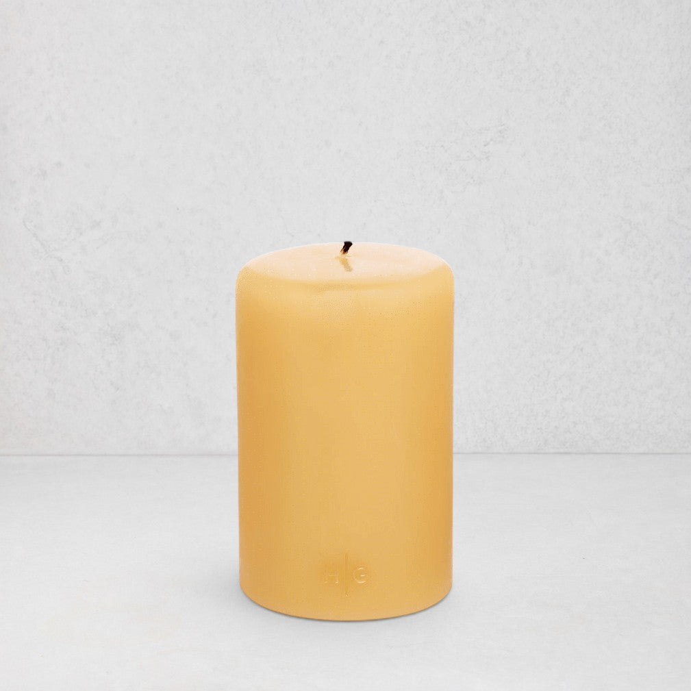 HG Amber Unscented Pillar Candle, 4"x6", with subtle gold HG logo.