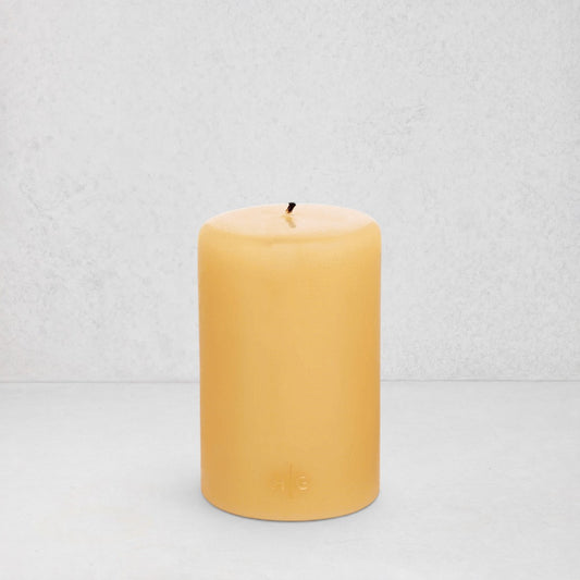 HG Amber Unscented Pillar Candle, 4"x6", with subtle gold HG logo.