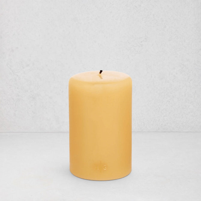 HG Amber Unscented Pillar Candle, 4"x6", with subtle gold HG logo.