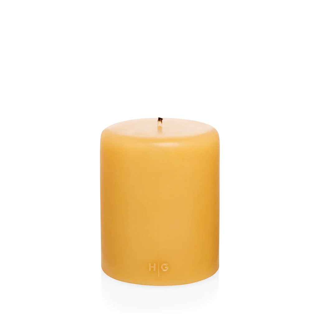 HG Amber Unscented Pillar Candle, 5"x6" paraffin, with gold HG logo and cotton wick.