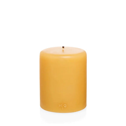 HG Amber Unscented Pillar Candle, 5"x6" paraffin, with gold HG logo and cotton wick.
