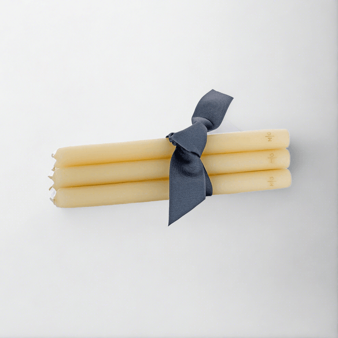 HG Amber Unscented 10" Taper Candle Bundle, set of 5, tied with a dark ribbon.