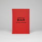 Red leather-bound American Bar book by Charles Schumann with black text.