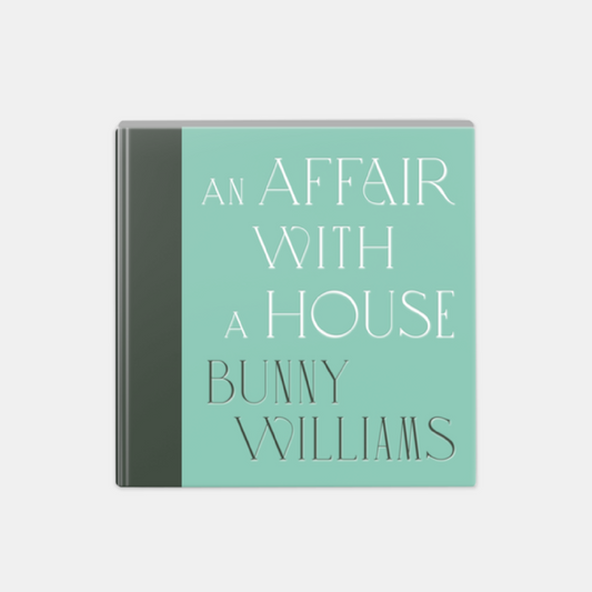 Hardcover book, "An Affair With A House" by Bunny Williams, light teal cover with white text.