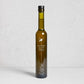 Ancient Olive Trees Dirty Martini Juice in a tall, dark green glass bottle with a black cap.