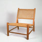 Andrea Woven Teak Wood Lounge Chair with light brown synthetic fiber seat and back.