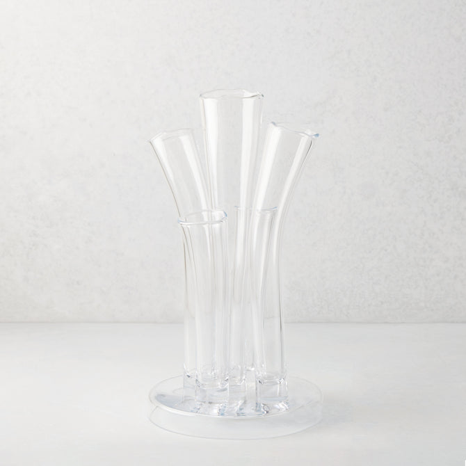 Angelina Small Scissor-Cut Glass Vase: Clear, handmade, thick glass vase with stair-step fluted tubes on a circular base.