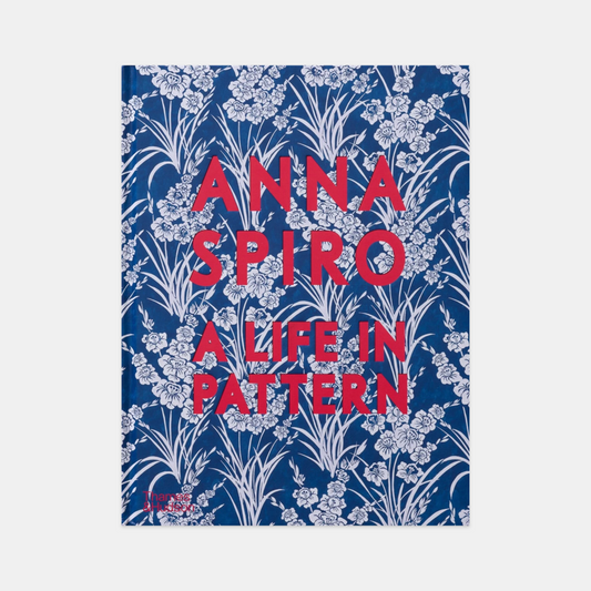 Hardcover book "Anna Spiro: A Life in Pattern" with blue floral design and red title text.