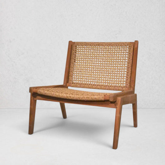 Anne Lounge Chair with a modern silhouette, solid reclaimed teak frame, and woven synthetic fiber seat and back.