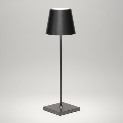 Antique Nickel Poldina Pro rechargeable LED lamp, sleek black metal with a conical shade and square base.